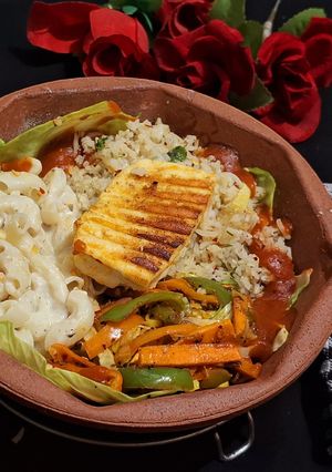 A picture of Veg Sizzler with Paneer Steak and creamy Pasta.