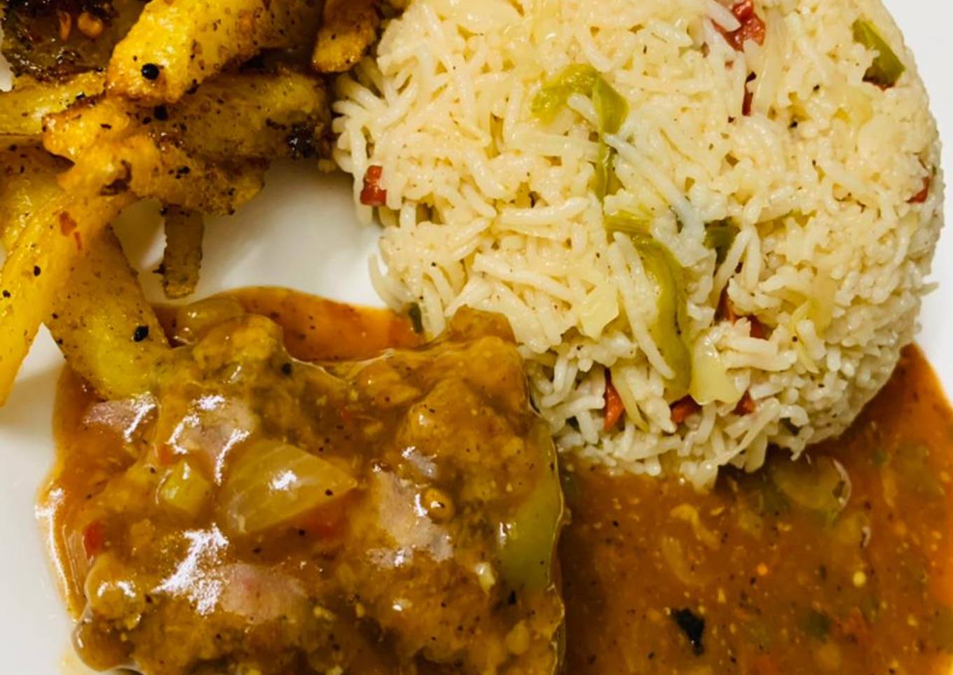 Spicy chicken machurian with fried rice and masala fries