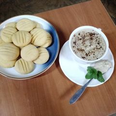 A picture of Custard black raisins cookies🍪 & Dalgona ☕ coffee.