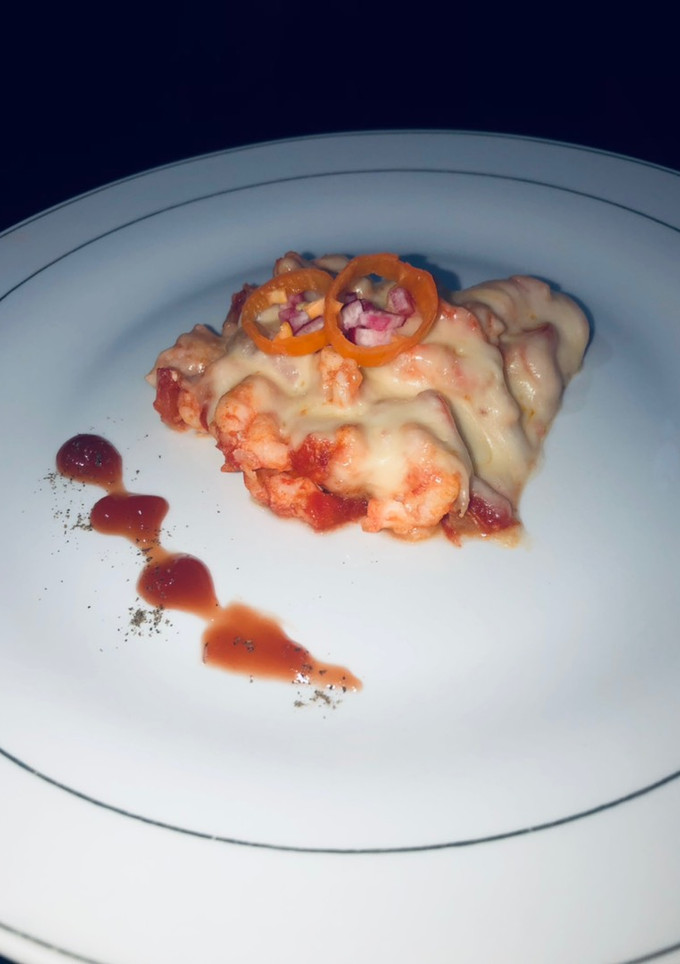 Una foto de Camarones con queso