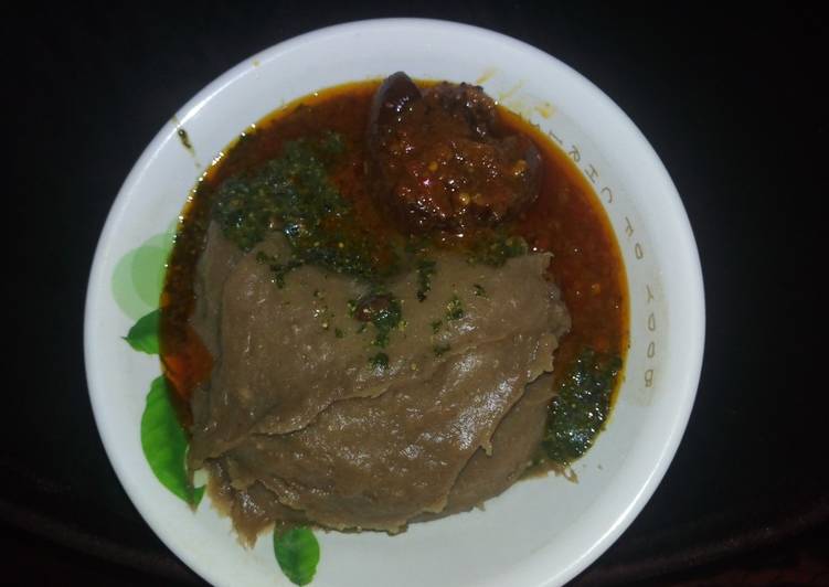 Amala(yam flour) with Ewedu and cow tail stew