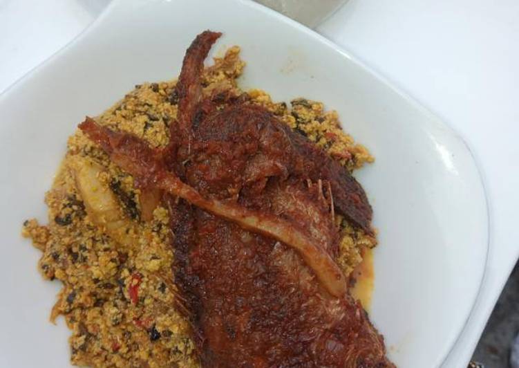 Egusi soup with bitter leaves and fish