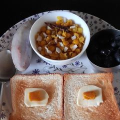 A picture of Ghugni with Toast and Fruits.