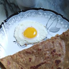 Anda Paratha with doodh pati😋 A picture of Anda Paratha with doodh pati😋.