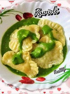 A picture of Veg Ravioli In Spinach Cream Sauce.