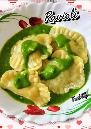 A picture of Veg Ravioli In Spinach Cream Sauce.