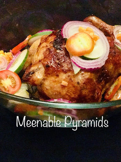 A picture of Stuffed chicken with couscous and veggies.