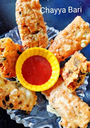 A picture of Papad roll stuffed with green coriander and dry coconut.