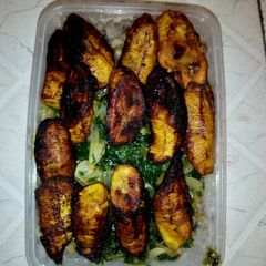 A picture of White beans, vegetable source and fried plantain.