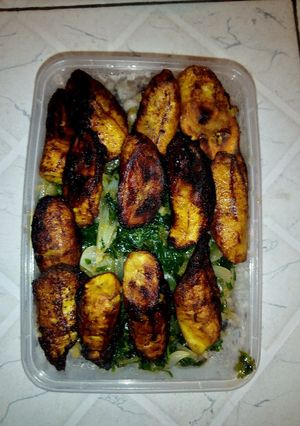 A picture of White beans, vegetable source and fried plantain.