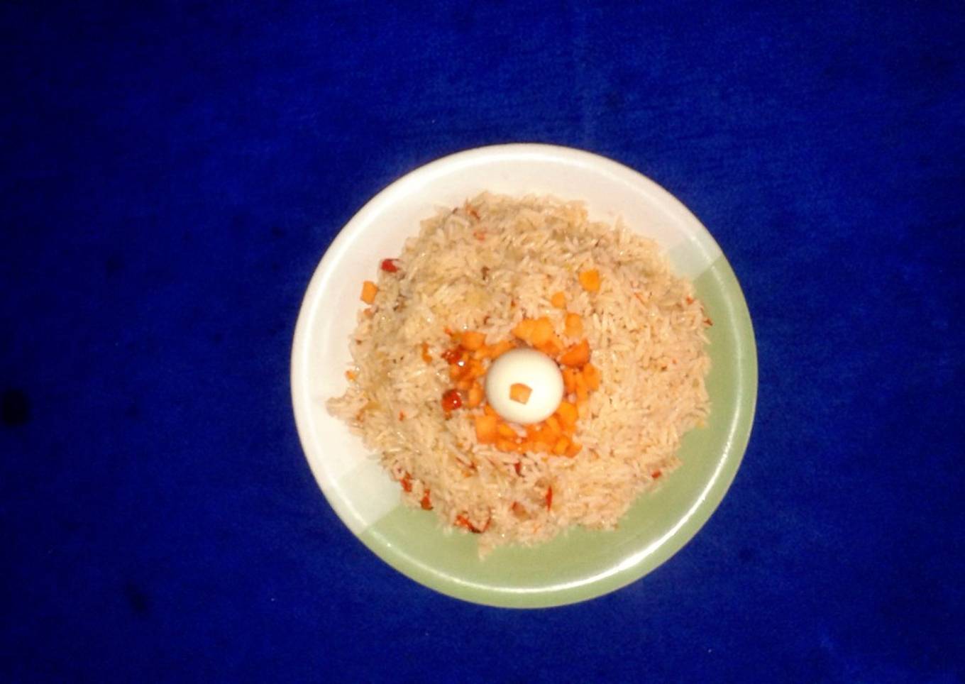 Jollof rice with boiled rice egg