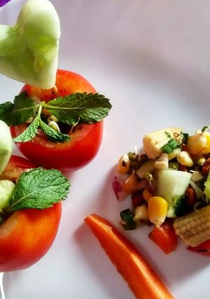 A picture of Tomato Cups Sprout Salad.