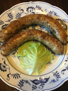 A picture of California Farm Bratwurst with gravy.