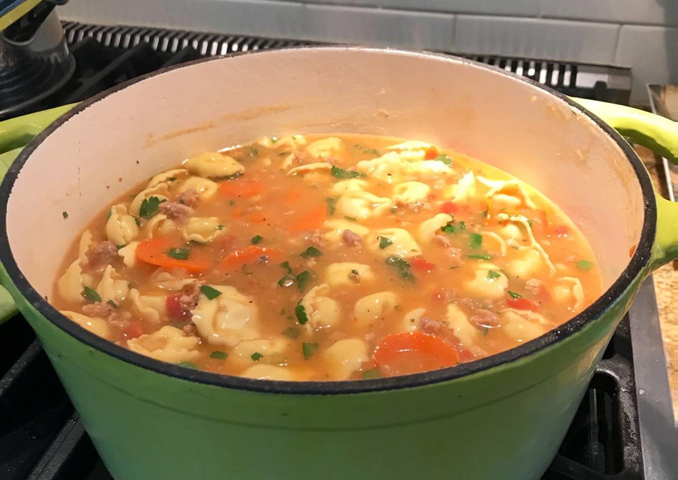 Thick and Spicy sausage, bean and cheese tortellini soup
