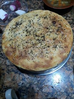 A picture of Sourdough bread in a pan.