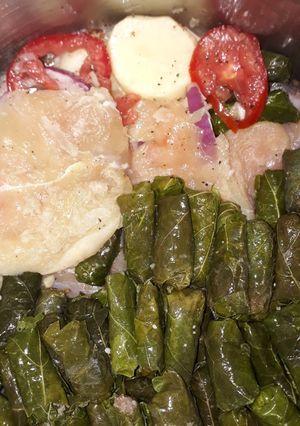 A picture of Stuffed Grape Leaves with Marinated Chicken Breasts.