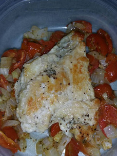 A picture of Chicken with Roasted Tomato and Red Onions.