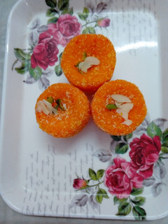 A picture of Orange coconut ladoo.