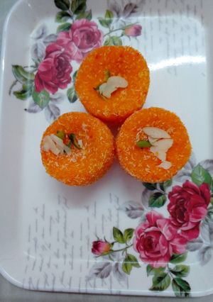 A picture of Orange coconut  ladoo.