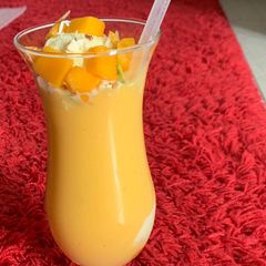 A picture of Mango milkshake with Ice cream.