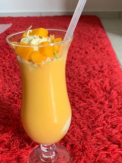 A picture of Mango milkshake with Ice cream.