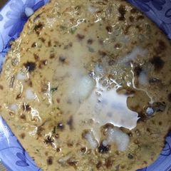 A picture of Gram roti with butter.