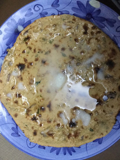 A picture of Gram roti with butter.