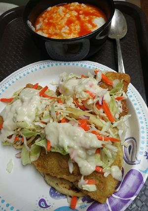 A picture of Fish Tacos with Grits.