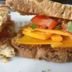 Cheese & Tomato sandwich with basil A picture of Cheese & Tomato sandwich with basil.