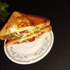 A picture of Egg in a hole sandwich.