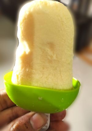 A picture of Kesar badam popsicles.