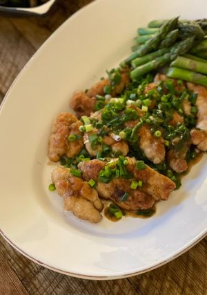 A picture of Sweetbreads with Madeira sauce, spring onions.