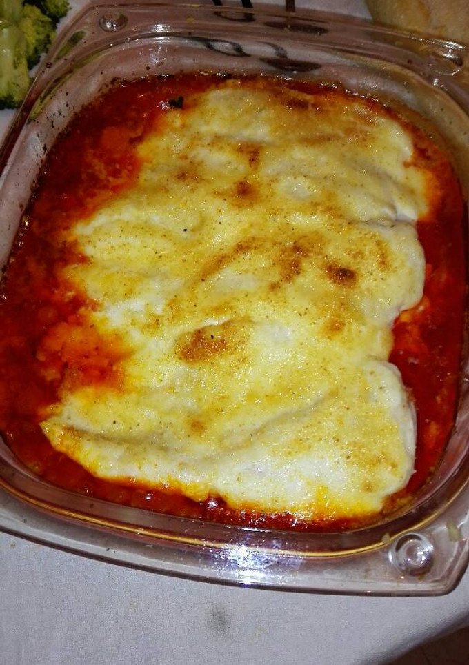 Una foto de Merluza al horno con tomate