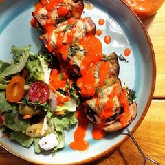 Salmon,aubergine and spinach skewers with red pepper dressing A picture of Salmon,aubergine and spinach skewers with red pepper dressing.