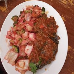 A picture of Grilled fish and Cubed buttered steamed vegetable salad.