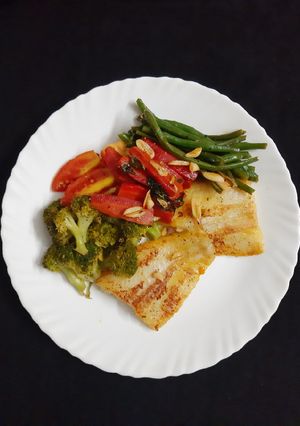 A picture of Orange Fish with veggies (Healthy Meal option).