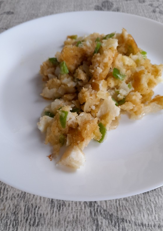 Una foto de Bacalao desmigado con pan rallado