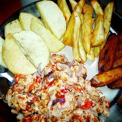 A picture of Fried yam,potato and plaintain with fried egg.