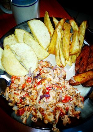 A picture of Fried yam,potato and plaintain with fried egg.