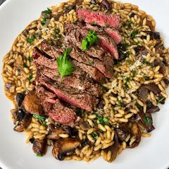 A picture of Fillet Steak with White Truffle Mushroom Risotto.