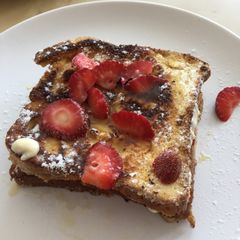 A picture of Breakfast french toast with strawberries.