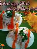 Boiled eggs filled with shredded chicken