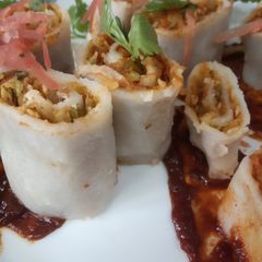 A picture of Rice Roulade with mixed vegetables.