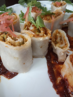 A picture of Rice Roulade with mixed vegetables.