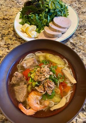 A picture of Vietnamese Pork Rib Noodle Soup with Taro Stem (Bún sườn bạc hà).