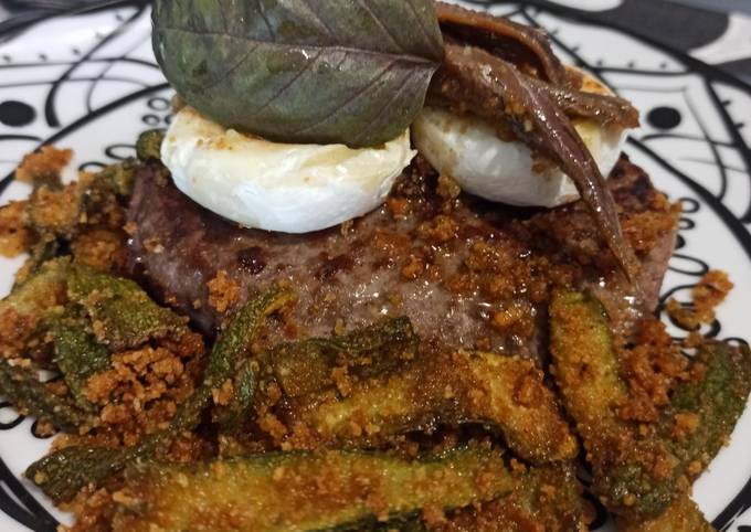 Hamburger con zucchine ammollicate, tomino e filetti di acciuga