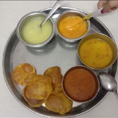 A picture of Summer Spoon Dish Aamras and masala puri.