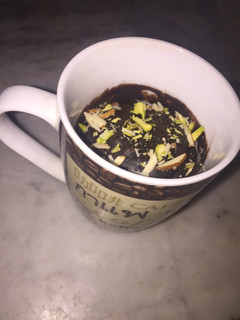 A picture of 1Min Choco Mug Brownie in microwave (eggless).