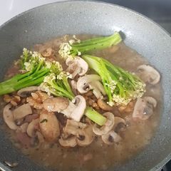A picture of Sauteé Caulini, Brown Mushroom, Bacon, and Walnut.