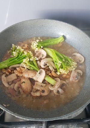 A picture of Sauteé Caulini, Brown Mushroom, Bacon, and Walnut.